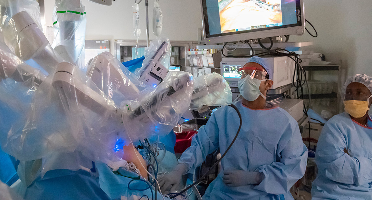 Surgical team prepares the da Vinci robotic system for an operation