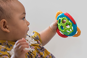 Healthy child playing with a toy
