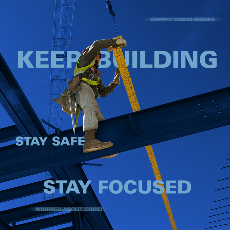 Construction worker standing on a beam
